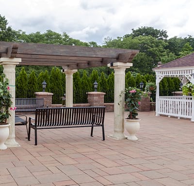 Outdoor seating area with a gazebo and garden