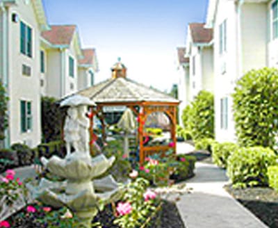 A landscaped outdoor area with gazebo and flowers