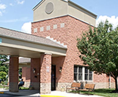 Exterior view of a senior living facility with entrance