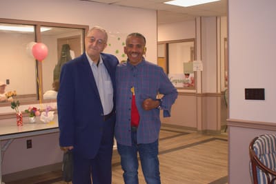 Residents celebrating with smiles in a common area