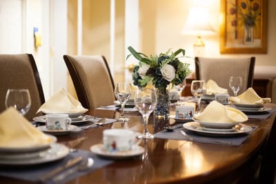 Elegant dining table set with floral centerpiece