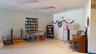 Bright activity room with festive decorations and equipment