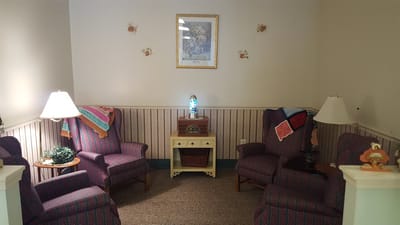 Cozy lounge area with chairs and decorative accents