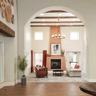 Bright common area with comfortable seating and fireplace