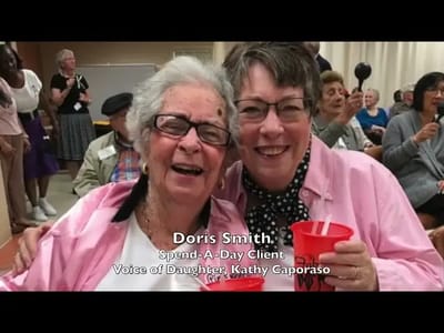 Two smiling residents enjoying an event together