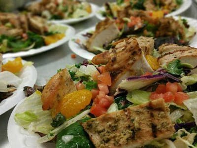 Close-up of a colorful salad plate with grilled chicken