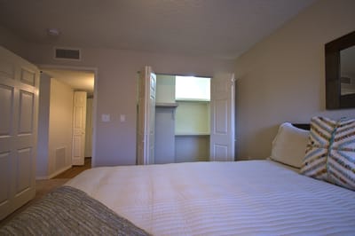 Private resident room with bed and closet