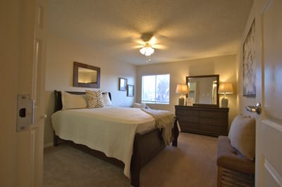 Cozy resident room with a bed and dresser