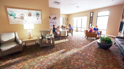 Residents and staff interacting in a common area