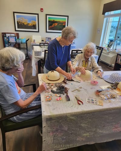 Residents participating in a craft activity at the facility