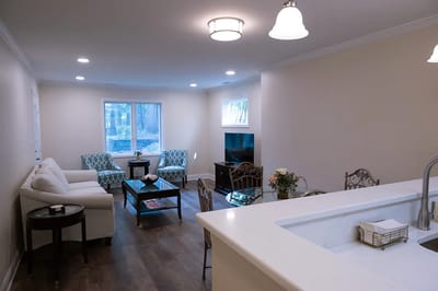 Bright interior common area with seating and a dining table