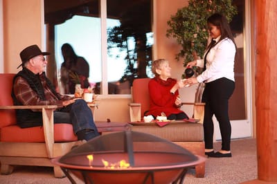 Staff serving refreshments to residents outdoors