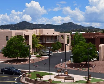 Exterior view of The Montecito Santa Fe with mountains