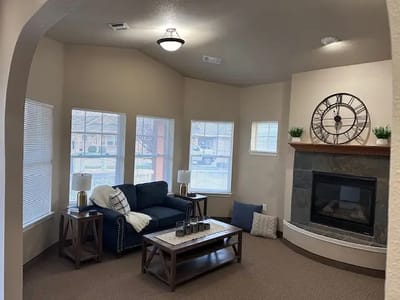 Cozy living room area with a fireplace and seating