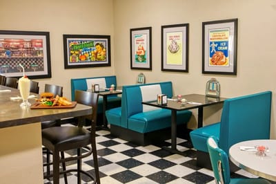 Retro dining area with booths and vintage posters