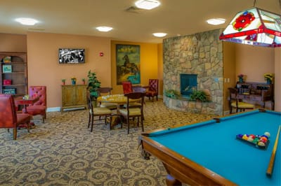 Interior common area with seating and a fireplace