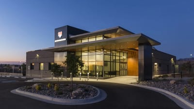 Exterior view of a modern assisted living facility at dusk