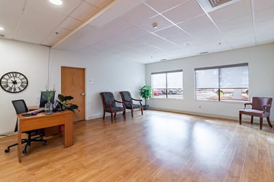 Bright common area with seating and natural light