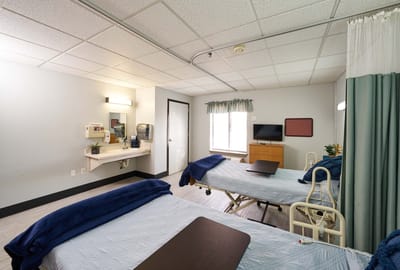 Bright, well-furnished resident room with two beds