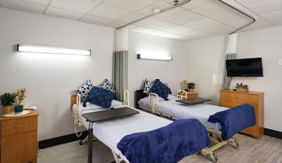 Interior view of a shared resident room with two beds
