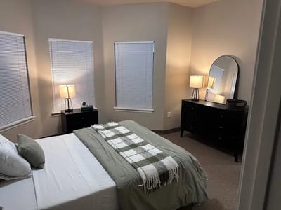 Cozy bedroom setup with natural light and simple decor