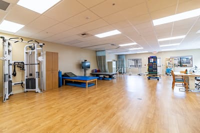 Interior view of a rehabilitation room with exercise equipment