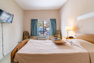 Private resident room with bed and window view