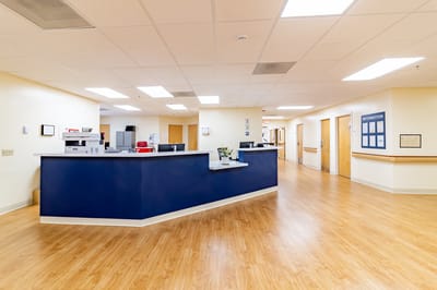 Spacious interior of a nursing facility reception area