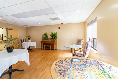 Bright common area with seating and activities