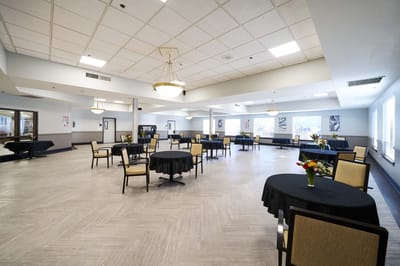 Dining room setup with tables and chairs