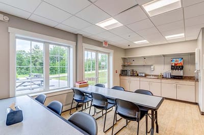 Bright interior common area with table and chairs