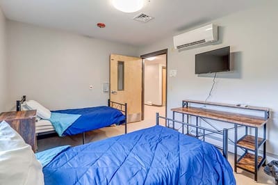 Interior view of a shared resident room with two beds