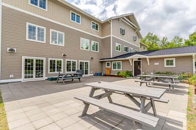 Exterior view of the facility with outdoor seating area