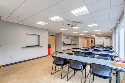 Bright common area with tables and chairs