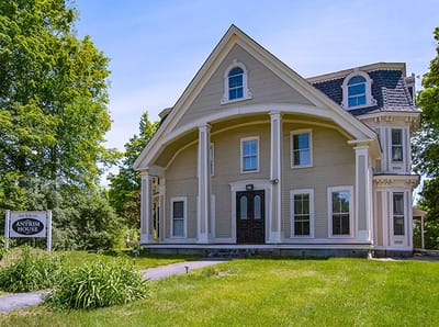 Exterior view of Antrim House with lush greenery