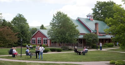 Residents enjoying time outdoors in front of the facility