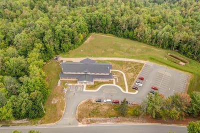 Aerial view of a nursing home facility surrounded by trees