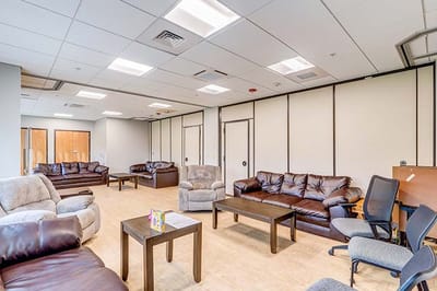Bright common area with seating and tables