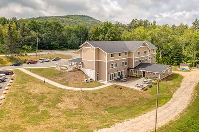 Aerial view of the assisted living facility surrounded by trees
