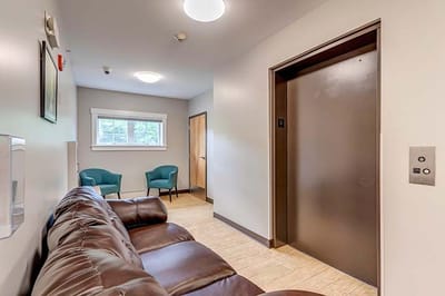 Interior view of a seating area near an elevator