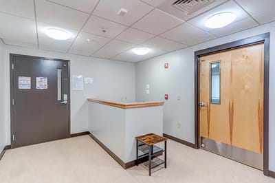 A hallway inside a modern assisted living facility