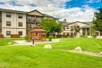Outdoor space featuring a gazebo and landscaped area