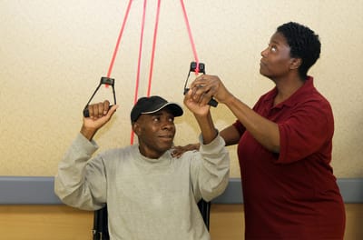 Residents engaging in physical therapy exercises