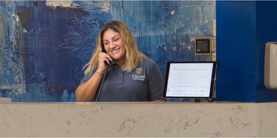 Reception area with a staff member at the front desk