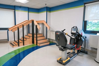 Rehabilitation space with gym equipment and stairs