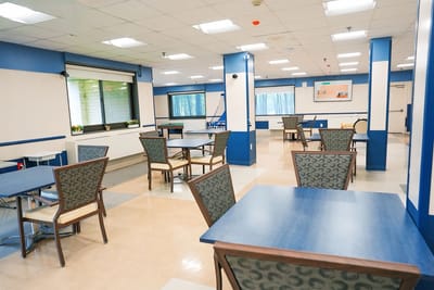 Bright common area with tables and chairs