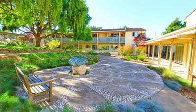 A serene courtyard with pathways and seating