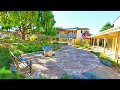Outdoor courtyard with benches and landscaping