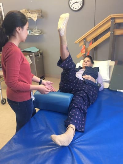 A resident participating in a therapy session with a staff member