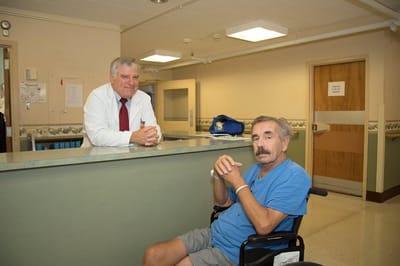 Staff member interacting with a resident in a facility interior